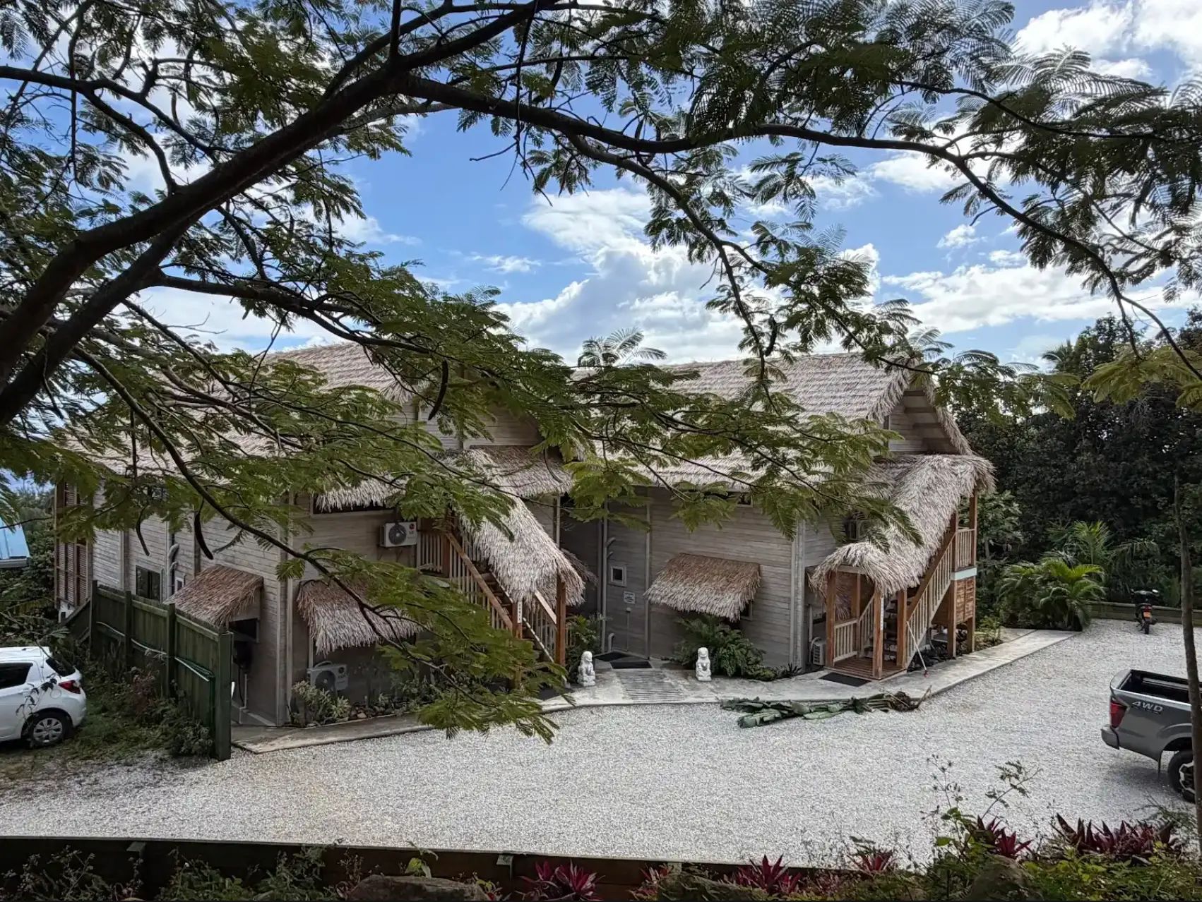 Two-storey thatched-roof tropical lodge completed by the team